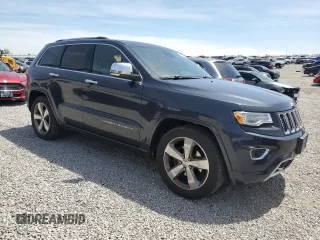 2016 Jeep Grand Cherokee Overland with VIN 1C4RJFCG9GC338165, listed as a Copart auction lot 54125815 with 102,302 mi miles and Salvage title. Bid and sale history available at DreamBid. Image 4.