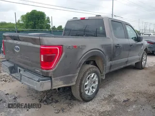 2023 Ford F-150 XL with VIN 1FTFW1E81PFB71702, listed as a IAAI auction lot 42102699 with 57,007 mi miles. Bid and sale history available at carsss.com. Image 4.