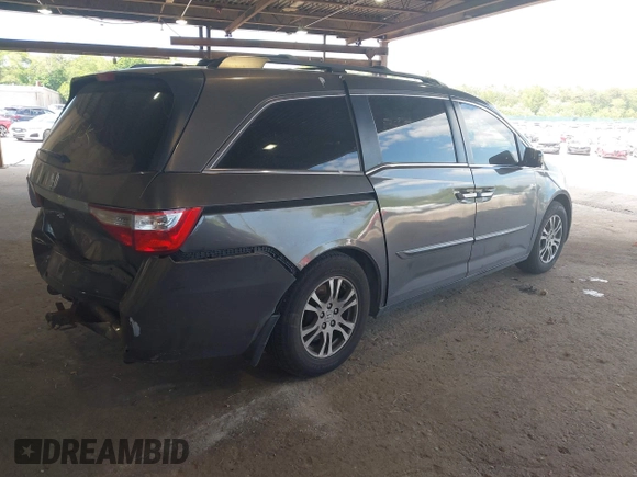 2012 Honda Odyssey EX-L with VIN 5FNRL5H67CB016934, listed as a IAAI auction lot 42405714 with 248,512 mi miles and . Bid and sale history available at DreamBid. Image 4.