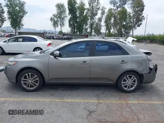 2012 Kia Forte EX with VIN KNAFU4A2XC5560585, listed as a IAAI auction lot 42121133 with 151,079 mi miles. Bid and sale history available at carsss.com. Image 14.