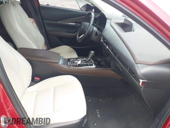 2023 Mazda CX-30 Premium с VIN 3MVDMBDY3PM507398, выставлен на аукционе IAAI как лот 42533176 с пробегом 15 788 миль миль и . История ставок и продаж доступна на DreamBid. Изображение 5.