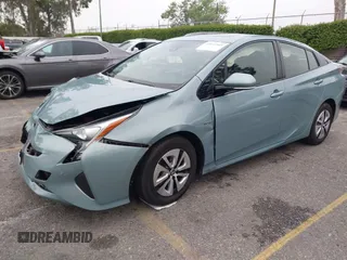 2017 Toyota Prius Two with VIN JTDKARFU7H3052594, listed as a IAAI auction lot 42035969 with 50,789 mi miles and . Bid and sale history available at DreamBid. Image 2.