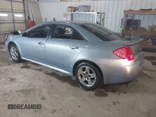 2009 Pontiac G6 1SB with VIN 1G2ZJ57B894237824, listed as a IAAI auction lot 41731113 with 144,914 mi miles and . Bid and sale history available at DreamBid. Image 3.