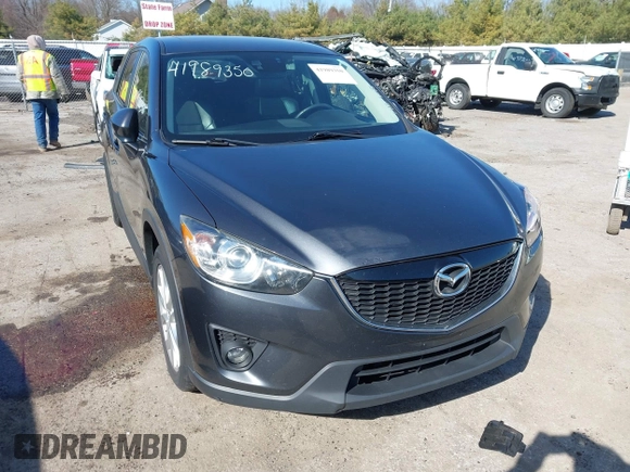 2014 Mazda CX-5 Grand Touring with VIN JM3KE4DY4E0320695, listed as a IAAI auction lot 41989350 with 169,391 mi miles and . Bid and sale history available at DreamBid. Image 1.