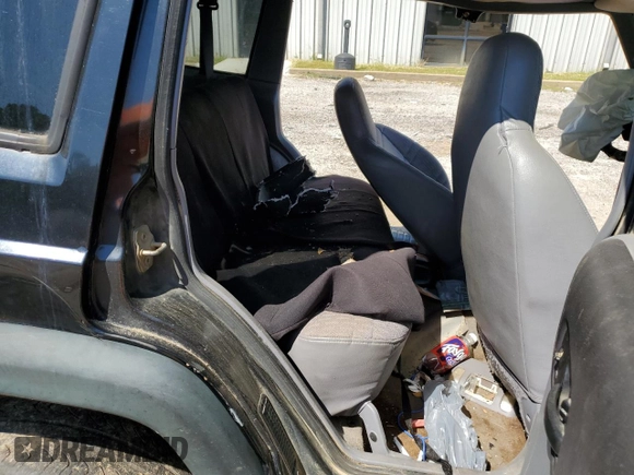 1998 Jeep Cherokee Sport with VIN 1J4FT68S9WL141631, listed as a Copart auction lot 68974974 with 0 mi miles and Salvage Title. Bid and sale history available at carsss.com. Image 12.