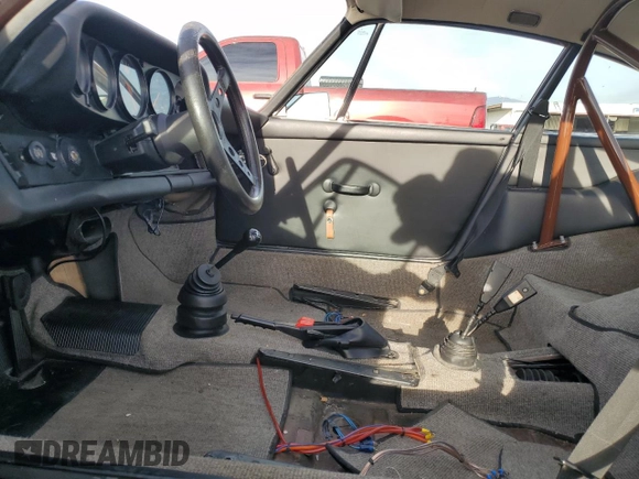 1975 Porsche 911 with VIN 9115201599, listed as a Copart auction lot 79267654 with 69,699 mi miles and Salvage title. Bid and sale history available at DreamBid. Image 7.