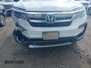 2020 Honda Pilot Elite with VIN 5FNYF6H08LB014288, listed as a IAAI auction lot 40496871 with 57,921 mi miles and . Bid and sale history available at DreamBid. Image 6.