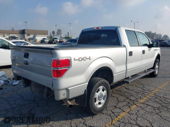 2014 Ford F-150 XL with VIN 1FTFW1EF9EKF99892, listed as a IAAI auction lot 41428456 with 128,659 mi miles and . Bid and sale history available at carsss.com. Image 4.