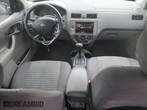 2005 Ford Focus S with VIN 1FAFP34N45W285454, listed as a Copart auction lot 59043485 with 165,071 mi miles and Salvage title. Bid and sale history available at DreamBid. Image 8.