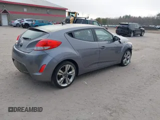 2014 Hyundai Veloster with VIN KMHTC6AD5EU183478, listed as a IAAI auction lot 42107170 with 64,905 mi miles. Bid and sale history available at carsss.com. Image 4.
