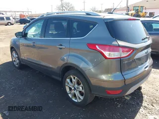 2014 Ford Escape Titanium with VIN 1FMCU9JX1EUB94776, listed as a IAAI auction lot 42063678 with 138,036 mi miles. Bid and sale history available at carsss.com. Image 3.