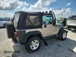 2003 Jeep Wrangler Rubicon with VIN 1J4FA69S13P310131, listed as a Copart auction lot 59139025 with 260,349 mi miles and Salvage title. Bid and sale history available at DreamBid. Image 3.