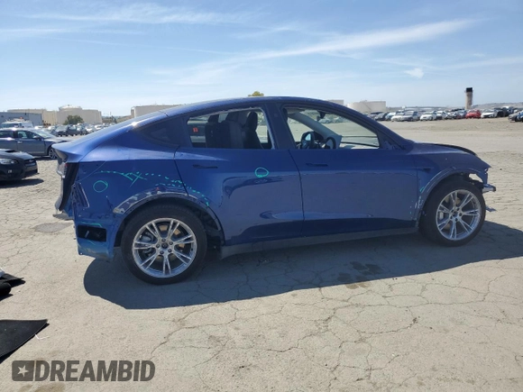 2024 Tesla Model Y Long Range z VIN 7SAYGAEE3RF034699, wystawiony jako Copart lot #54523815 z przebiegiem 9 764 mil mil oraz Szkoda całkowita • Salvage title. Historia ofert i sprzedaży dostępna na DreamBid. Obrazek 3.