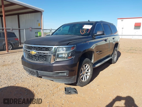 2015 Chevrolet Tahoe LS with VIN 1GNSCAKC9FR122896, listed as a IAAI auction lot 42239812 with 164,888 mi miles and . Bid and sale history available at DreamBid. Image 2.