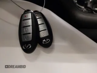 2015 Infiniti Q50 Premium z VIN JN1BV7AR0FM417283, wystawiony jako IAAI lot #41579549 z przebiegiem 112 407 mil mil oraz . Historia ofert i sprzedaży dostępna na DreamBid. Obrazek 11.