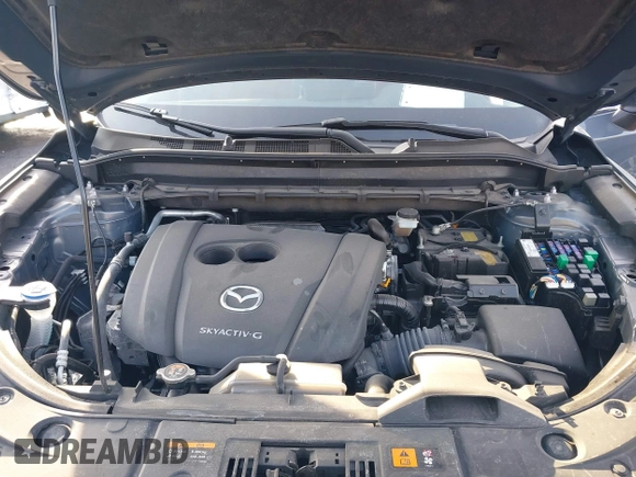 2021 Mazda CX-5 Touring z VIN JM3KFBCMXM0463469, wystawiony jako IAAI lot #41488993 z przebiegiem 28 582 mil mil oraz . Historia ofert i sprzedaży dostępna na DreamBid. Obrazek 10.