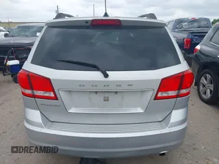 2013 Dodge Journey SE z VIN 3C4PDCAB9DT529668, wystawiony jako IAAI lot #42130654 z przebiegiem 156 472 mil mil oraz . Historia ofert i sprzedaży dostępna na DreamBid. Obrazek 17.