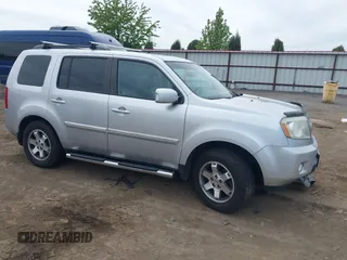 2011 Honda Pilot Touring z VIN 5FNYF4H99BB097506, wystawiony jako IAAI lot #42244046 z przebiegiem 209 510 mil mil oraz . Historia ofert i sprzedaży dostępna na DreamBid. Obrazek 1.