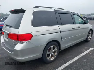 2009 Honda Odyssey Touring with VIN 5FNRL38859B029714, listed as a IAAI auction lot 42266381 with 196,747 mi miles and . Bid and sale history available at DreamBid. Image 4.