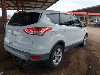 2013 Ford Escape SE with VIN 1FMCU0G95DUD02318, listed as a IAAI auction lot 42195213 with 202,434 mi miles and . Bid and sale history available at DreamBid. Image 4.