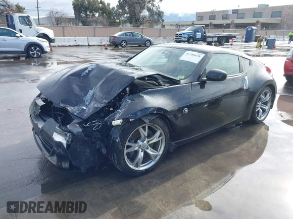 2012 Nissan 370Z Touring with VIN JN1AZ4EH4CM561303, listed as a IAAI auction lot 41788638 with 111,958 mi miles. Bid and sale history available at carsss.com. Image 2.