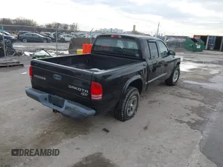 2004 Dodge Dakota Sport with VIN 1D7HL38N24S768283, listed as a IAAI auction lot 41635910 with 328,505 mi miles. Bid and sale history available at carsss.com. Image 4.