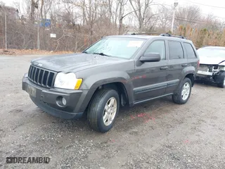 2005 Jeep Grand Cherokee Laredo with VIN 1J4GR48K35C702010, listed as a IAAI auction lot 41043017 with 150,565 mi miles. Bid and sale history available at carsss.com. Image 2.