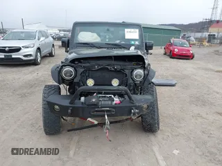 2014 Jeep Wrangler Sahara with VIN 1C4AJWBG9EL311477, listed as a IAAI auction lot 41884255 with 82,221 mi miles and . Bid and sale history available at carsss.com. Image 13.