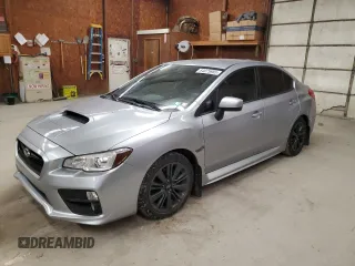 2015 Subaru WRX with VIN JF1VA1A68F9801796, listed as a Copart auction lot 64075985 with 104,943 mi miles and Salvage title. Bid and sale history available at DreamBid. Image 1.