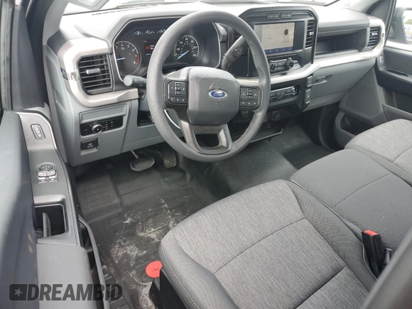 2023 Ford F-150 XL with VIN 1FTMF1C57PKF86630, listed as a Copart auction lot 59172785 with 14,840 mi miles and Salvage title. Bid and sale history available at DreamBid. Image 8.