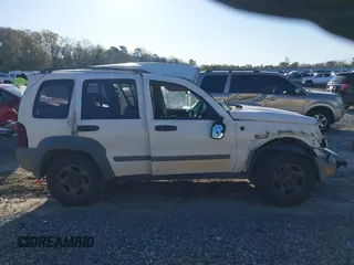 2005 Jeep Liberty Sport with VIN 1J4GK48KX5W679070, listed as a IAAI auction lot 41807899 with 157,726 mi miles. Bid and sale history available at carsss.com. Image 13.