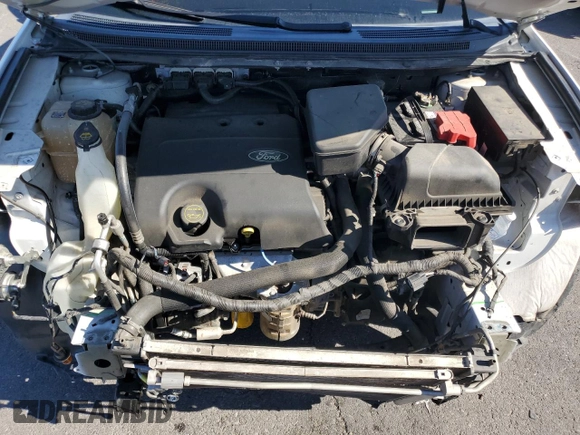 2014 Ford Edge SE z VIN 2FMDK3GC8EBB39954, wystawiony jako Copart lot #56427345 z przebiegiem 139 731 mil mil oraz Szkoda całkowita • Salvage title. Historia ofert i sprzedaży dostępna na DreamBid. Obrazek 11.