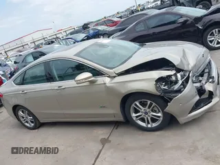 2015 Ford Fusion Energi Titanium with VIN 3FA6P0SU3FR114739, listed as a IAAI auction lot 42003011 with 120,553 mi miles. Bid and sale history available at carsss.com. Image 13.