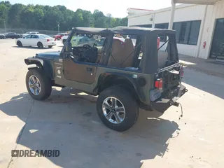2002 Jeep Wrangler Sport with VIN 1J4FA49S52P760173, listed as a IAAI auction lot 42468550 with 201,682 mi miles and . Bid and sale history available at DreamBid. Image 3.