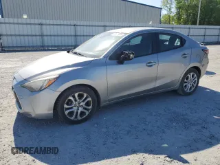 2016 Scion iA z VIN 3MYDLBZV3GY119729, wystawiony jako Copart lot #52571955 z przebiegiem 59 605 mil mil oraz Szkody całkowita. Historia ofert i sprzedaży dostępna na DreamBid. Obrazek 1.