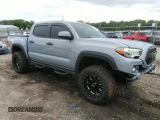 2018 Toyota Tacoma SR with VIN 5TFCZ5ANXJX155982, listed as a IAAI auction lot 42343938 with 92,666 mi miles and . Bid and sale history available at DreamBid. Image 1.
