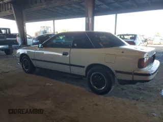 1986 Toyota Celica z VIN JT2ST64CXG7013064, wystawiony jako Copart lot #44228575 z przebiegiem 101 881 mil mil oraz Szkoda całkowita • Salvage title. Historia ofert i sprzedaży dostępna na DreamBid. Obrazek 2.