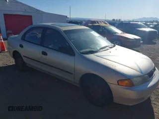 1997 Mazda Protege DX with VIN JM1BC1412V0155780, listed as a IAAI auction lot 42134286 with Not Provided miles and . Bid and sale history available at DreamBid. Image 1.