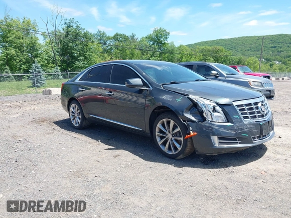 2013 Cadillac XTS Luxury z VIN 2G61R5S33D9101434, wystawiony jako IAAI lot #42290199 z przebiegiem 48 075 mil mil oraz . Historia ofert i sprzedaży dostępna na DreamBid. Obrazek 1.