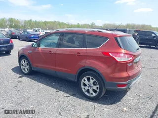 2015 Ford Escape Titanium with VIN 1FMCU0JX5FUB77475, listed as a IAAI auction lot 42103388 with 113,018 mi miles. Bid and sale history available at carsss.com. Image 3.