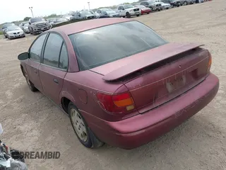 2002 Saturn SL z VIN 1G8ZF52802Z248375, wystawiony jako IAAI lot #42180352 z przebiegiem Nie podano mil oraz . Historia ofert i sprzedaży dostępna na DreamBid. Obrazek 3.