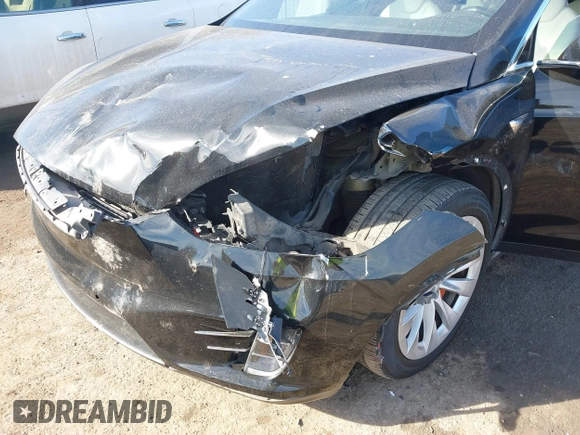 2018 Tesla Model X 75D with VIN 5YJXCDE44JF091690, listed as a IAAI auction lot 41585617 with 128,826 mi miles and . Bid and sale history available at DreamBid. Image 6.