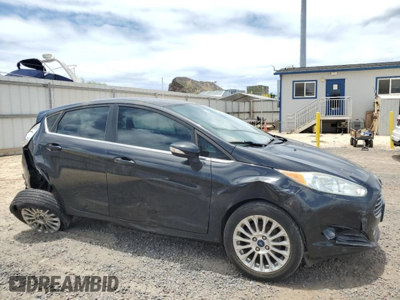 2014 Ford Fiesta Titanium z VIN 3FADP4FJXEM228098, wystawiony jako Copart lot #55173975 z przebiegiem 109 311 mil mil oraz Szkoda całkowita • Salvage title. Historia ofert i sprzedaży dostępna na DreamBid. Obrazek 4.