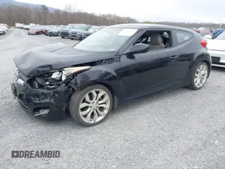 2012 Hyundai Veloster w/Gray Int z VIN KMHTC6AD6CU054422, wystawiony jako IAAI lot #41930634 z przebiegiem 144 681 mil mil oraz . Historia ofert i sprzedaży dostępna na DreamBid. Obrazek 2.