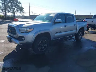 2018 Toyota Tacoma SR with VIN 3TMCZ5ANXJM184341, listed as a IAAI auction lot 41376837 with 94,560 mi miles. Bid and sale history available at carsss.com. Image 2.