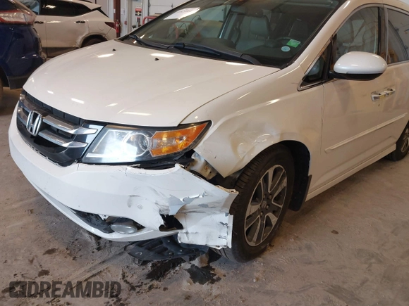 2015 Honda Odyssey Touring Elite with VIN 5FNRL5H97FB060060, listed as a IAAI auction lot 41829864 with Not Provided miles and . Bid and sale history available at DreamBid. Image 6.