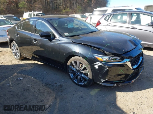 2018 Mazda 6 Grand Touring with VIN JM1GL1TY0J1319083, listed as a IAAI auction lot 40852818 with 57,408 mi miles and . Bid and sale history available at DreamBid. Image 1.