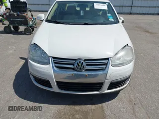 2009 Volkswagen Jetta SE z VIN 3VWRM71K99M057390, wystawiony jako IAAI lot #42094648 z przebiegiem 168 533 mil mil oraz . Historia ofert i sprzedaży dostępna na DreamBid. Obrazek 13.