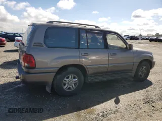 2000 Lexus LX 470 z VIN JT6HT00W9Y0120042, wystawiony jako Copart lot #49644355 z przebiegiem 188 992 mil mil oraz Czysty tytuł • Clean title. Historia ofert i sprzedaży dostępna na DreamBid. Obrazek 3.