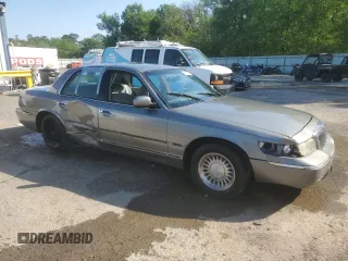 1999 Mercury Grand Marquis LS z VIN 2MEFM75W9XX687526, wystawiony jako Copart lot #51779995 z przebiegiem 196 466 mil mil oraz Szkoda całkowita • Salvage title. Historia ofert i sprzedaży dostępna na DreamBid. Obrazek 4.